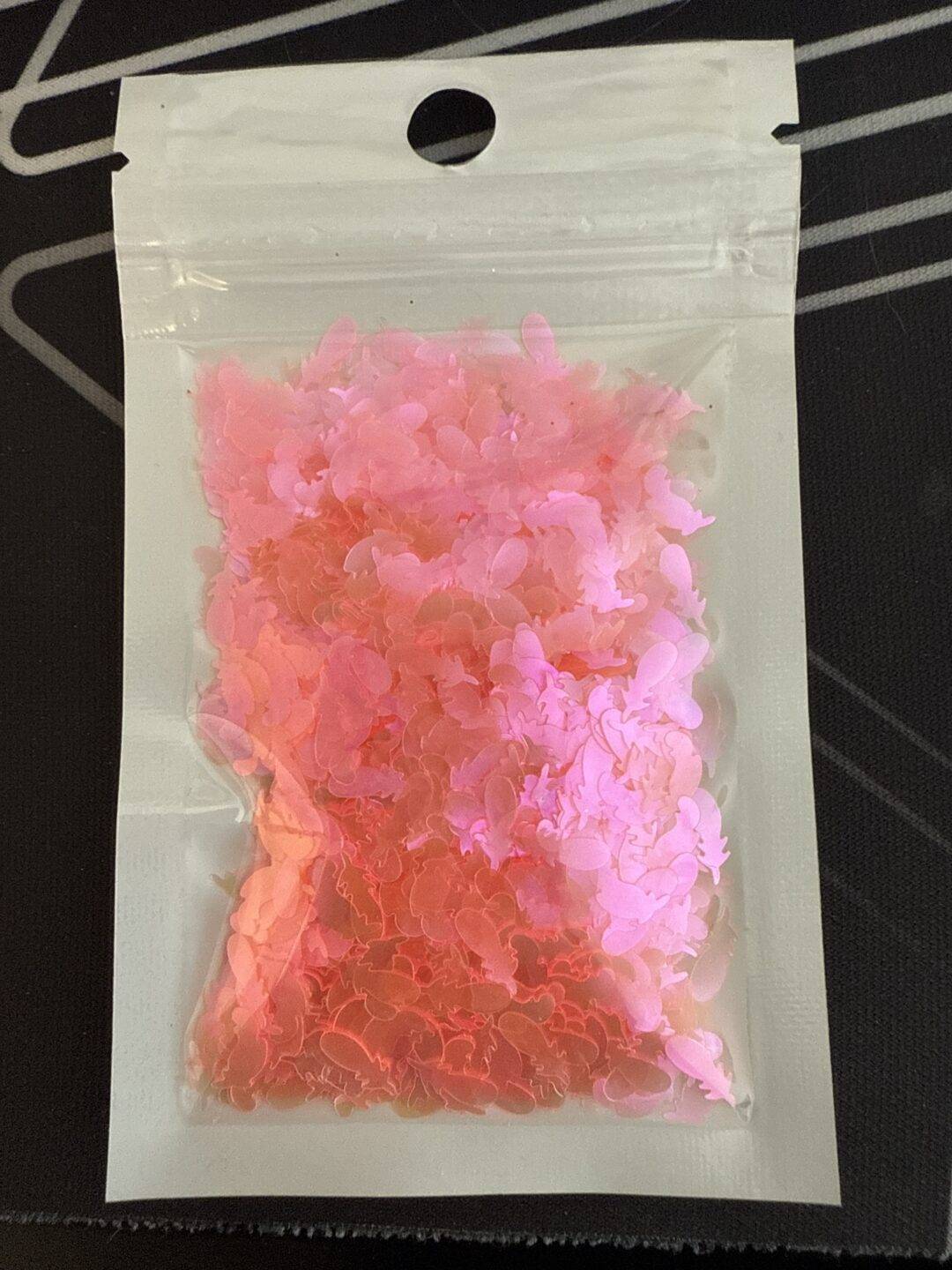 Rondje met 1 roze veer